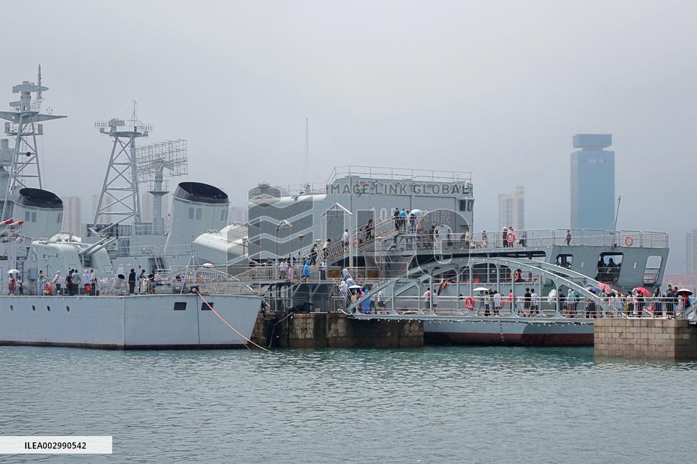 Tourists Visit A Decommissioned Warship in Qingdao