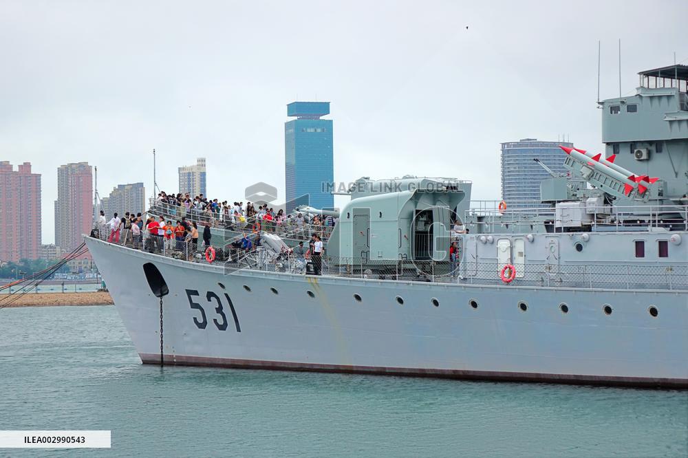 Tourists Visit A Decommissioned Warship in Qingdao