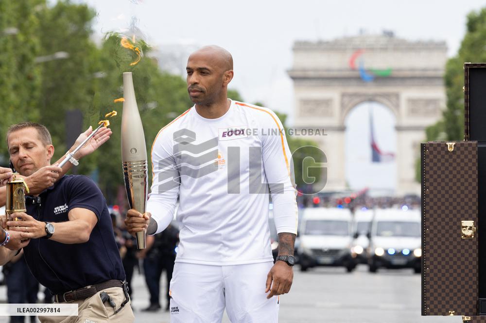 Olympic Torch Relay Along the Champs-Elysees Avenue - Paris