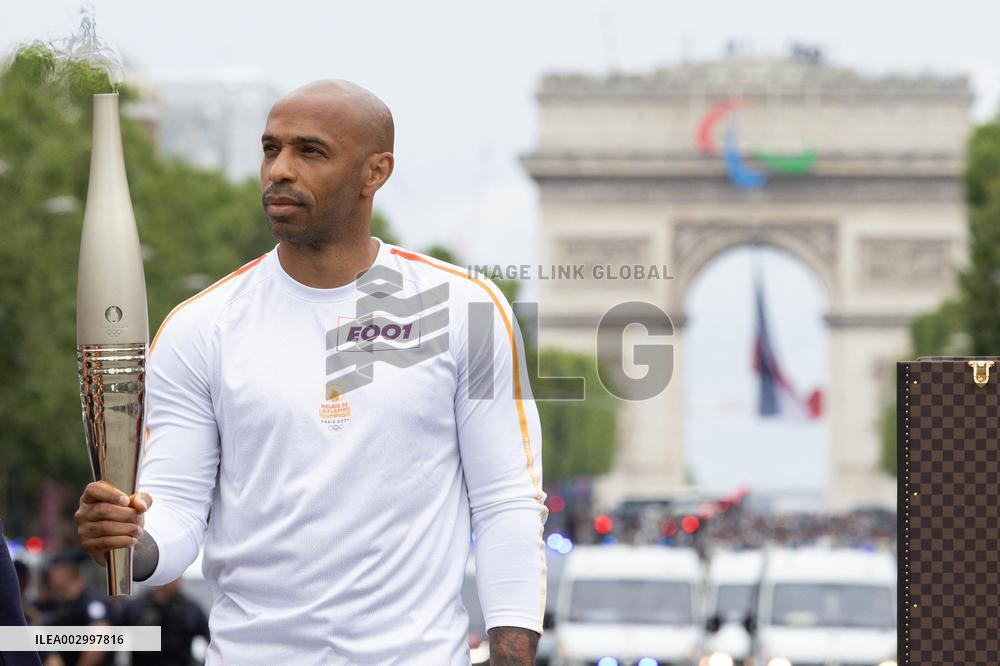 Olympic Torch Relay Along the Champs-Elysees Avenue - Paris