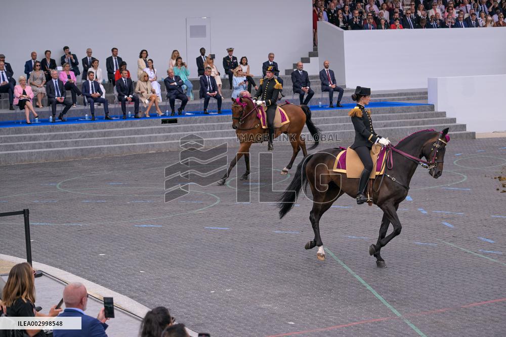 Olympic flame during the annual Bastille Day military parade - Paris
