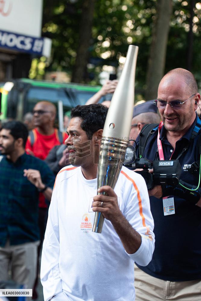 Paris 2024 - Jamel Debbouze Carries The Olympic Torch