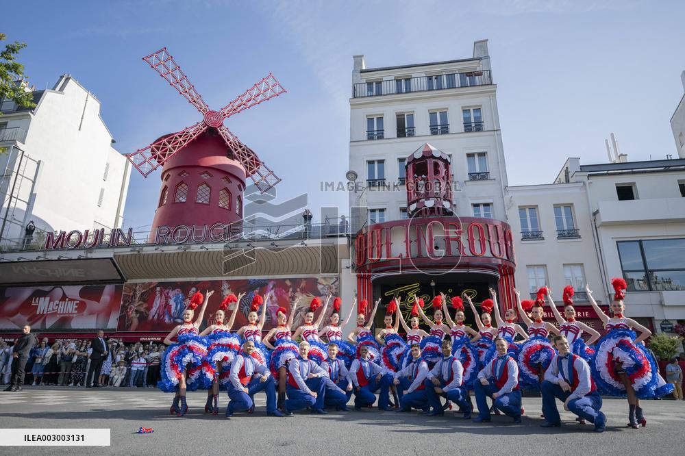Paris 2024 - The Olympic Flame Stops By The Moulin Rouge