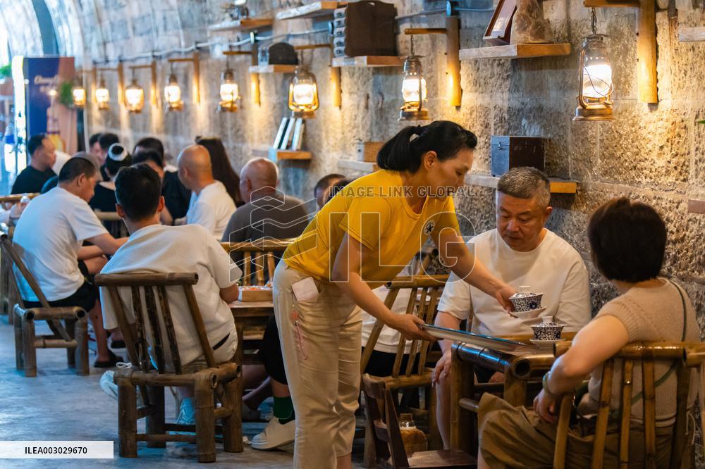 Residents at A Bomb Shelter to Cool Off in Chongqing