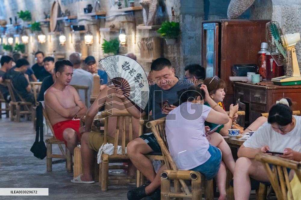 Residents at A Bomb Shelter to Cool Off in Chongqing