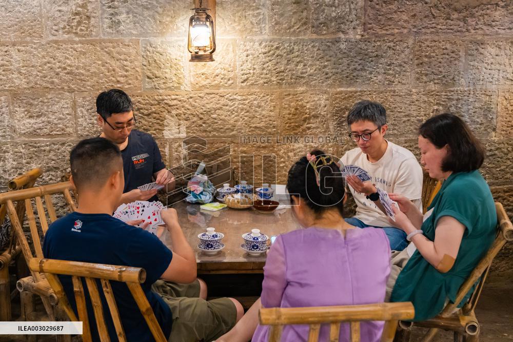 Residents at A Bomb Shelter to Cool Off in Chongqing
