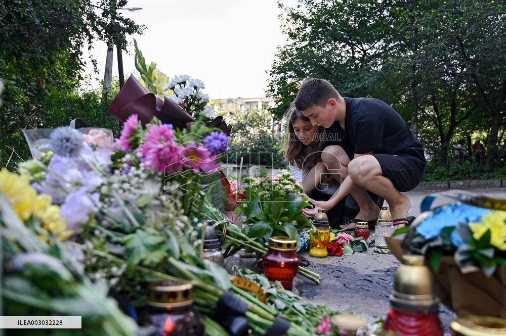 Lviv residents bring flowers to murder site of Iryna Farion