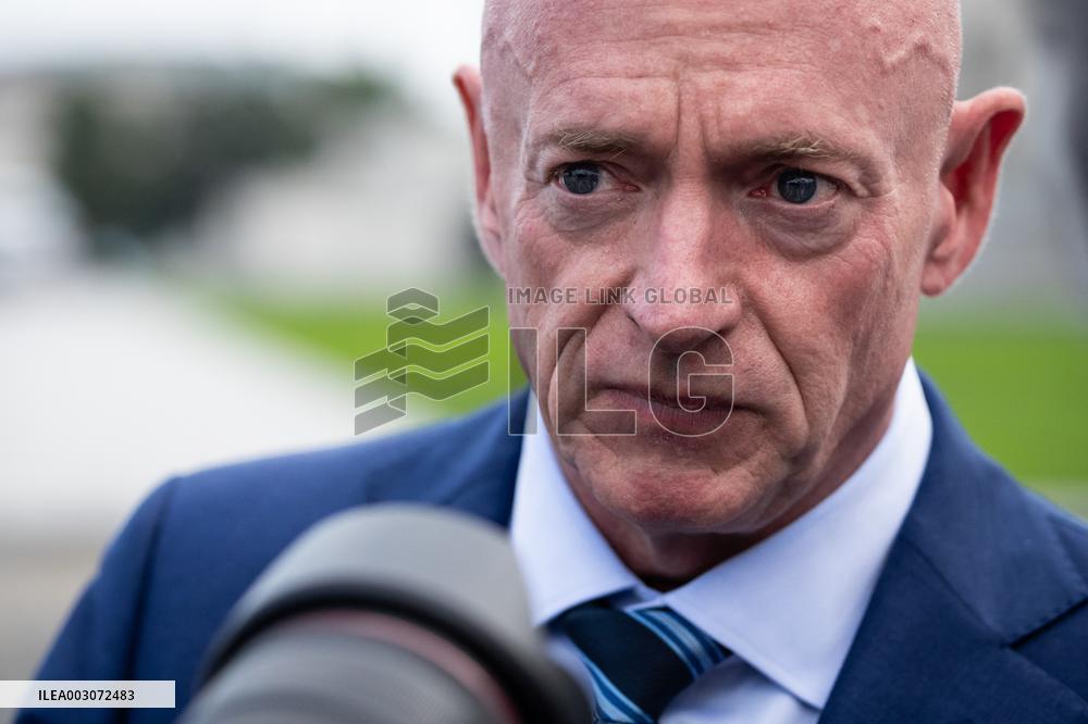 Potential Vice President nominee Sen. Mark Kelly speaks with reporters outside the Capitol