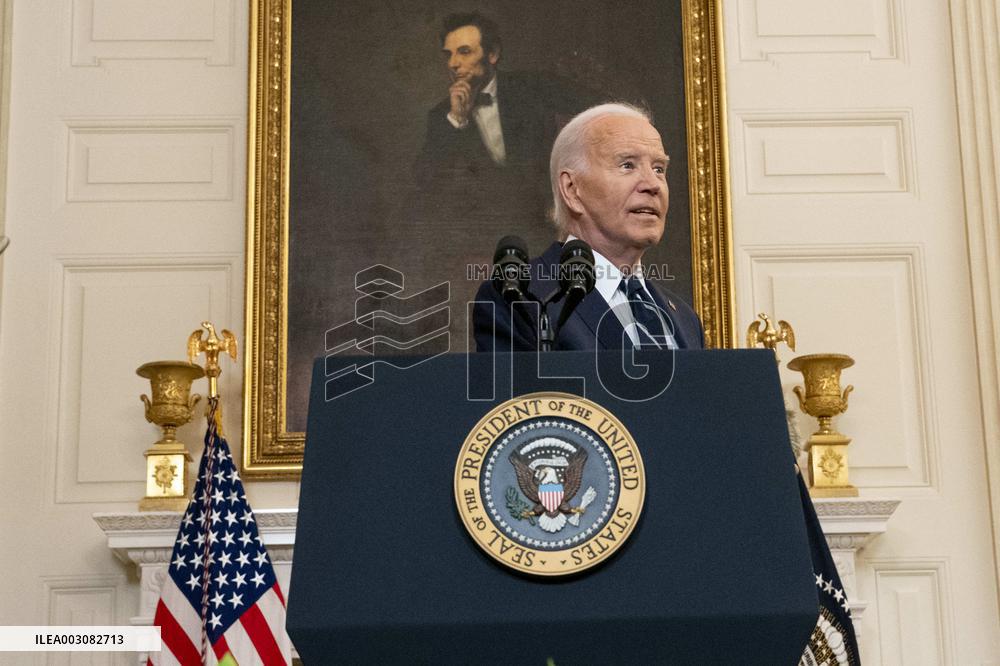 U.S. President Joe Biden stands with hostage familes the White House