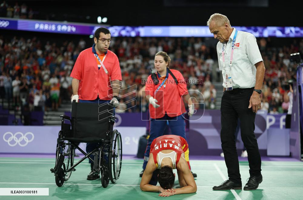 Paris 2024 - Carolina Marin of Spain suffers an injury during badminton women's singles