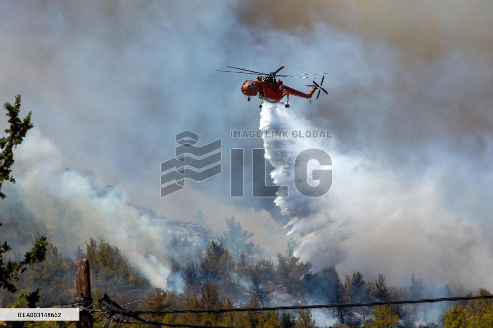 Thousands Evacuated As Wildfires Approach Athens