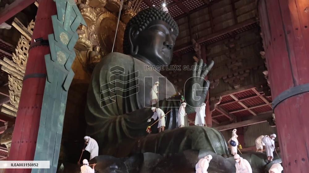 Annual cleaning of Great Buddha of Nara