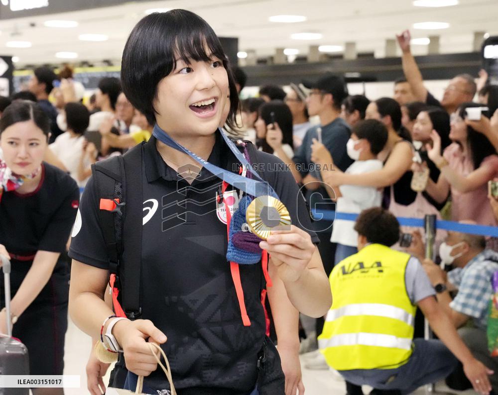 Japan athletes return home from Paris