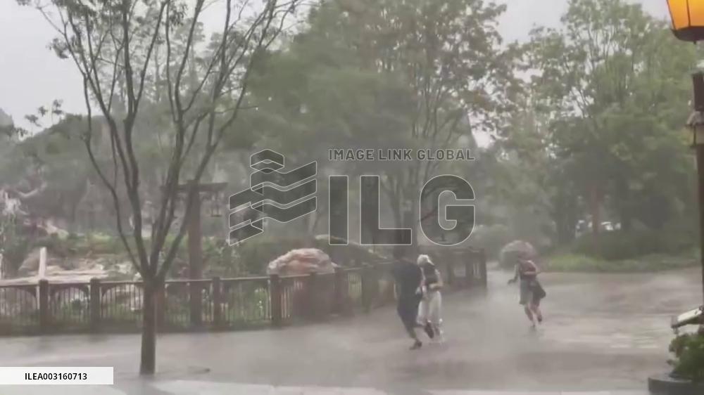 Japan: Guests Run For Cover At Tokyo DisneySea As Typhoon Ampil Brings Torrential Rain