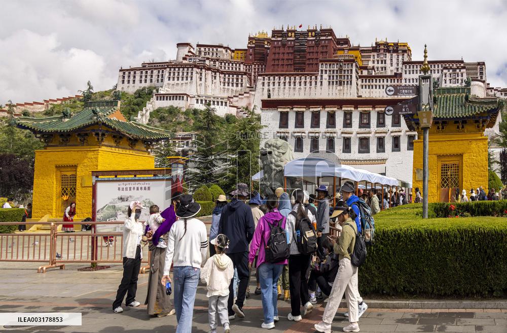 Tourists Visit The Potala Palace in Lhasa