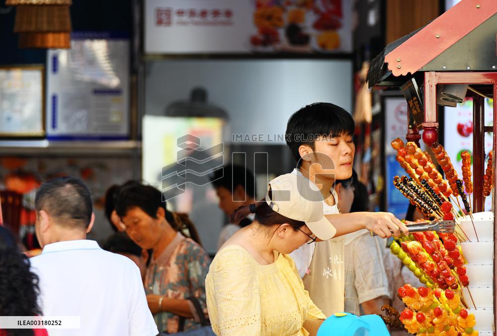 Tourists Visit Wangfujing Pedestrian Street in Beijing