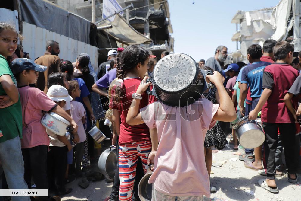 People Receive Food Aid In Jabalia Camp - Gaza