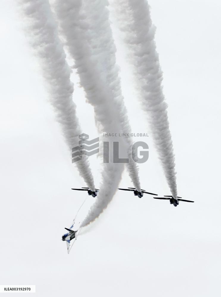 Blue Impulse aerobatic team flies over ASDF base in northeastern Japan