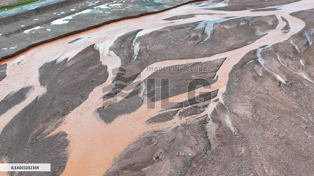 Red Rivers Flow Through Grassland in Haixi