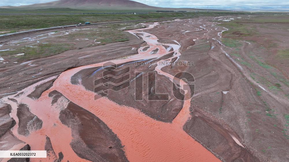 Red Rivers Flow Through Grassland in Haixi
