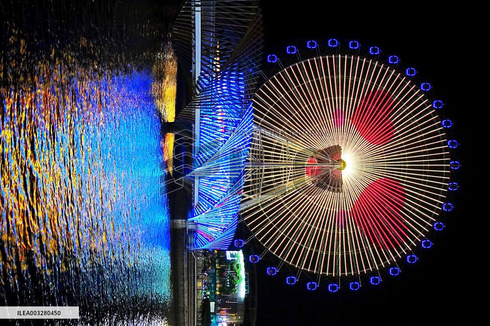 Rainbow Bridge and Ferris Wheel Night View in Qingdao