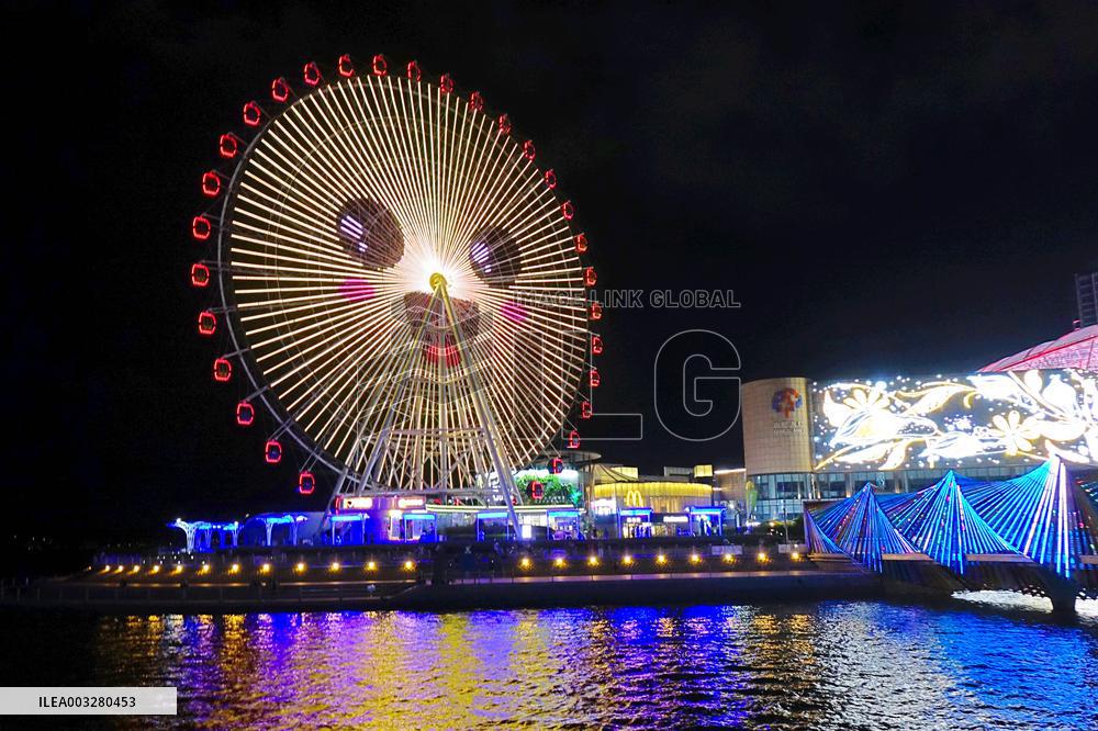 Rainbow Bridge and Ferris Wheel Night View in Qingdao