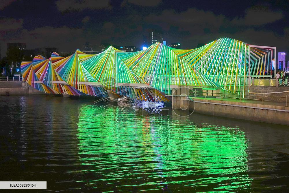 Rainbow Bridge and Ferris Wheel Night View in Qingdao