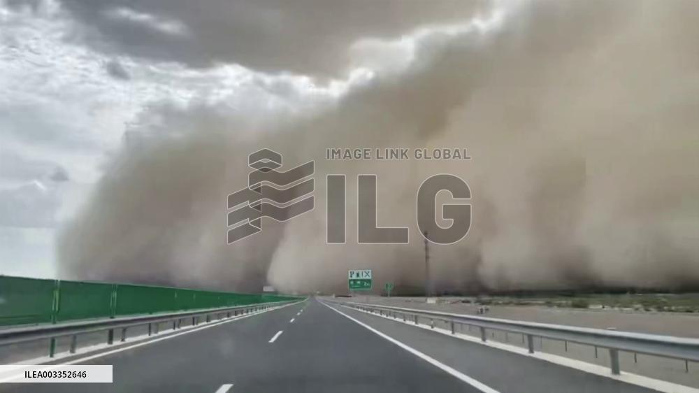 China: Vehicle Encounters Severe Sandstorm On Highway In Guazhou, Gansu