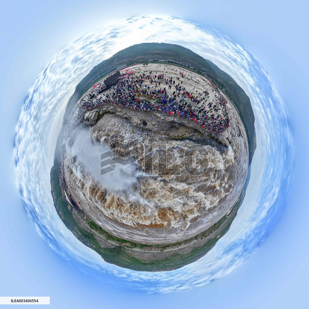 Tourists Visit The Hukou Waterfall - China