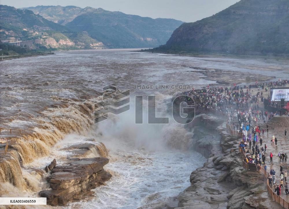 Tourists Visit The Hukou Waterfall - China