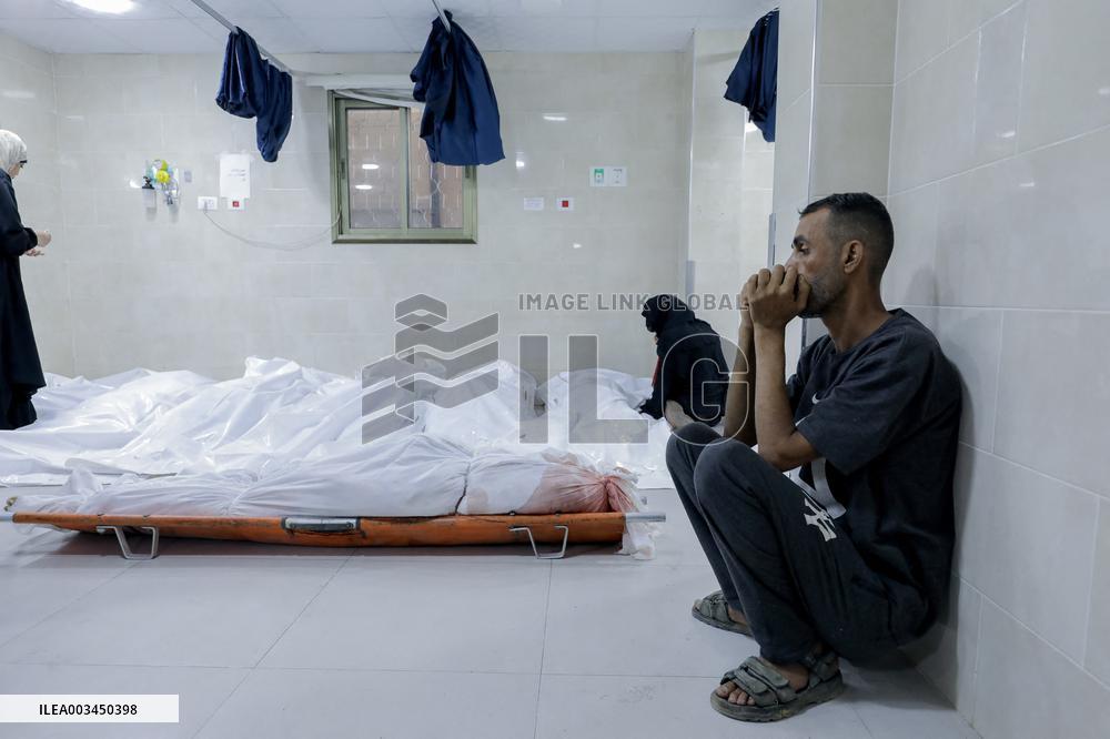 Relatives of the victims killed in the airstrike on Al-Mufti school in Nuseirat Camp