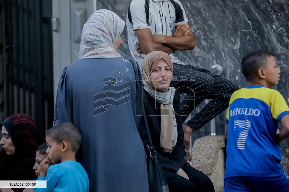 Relatives of the victims killed in the airstrike on Al-Mufti school in Nuseirat Camp