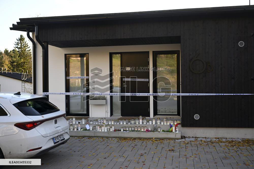 Police tape and candles at Janne Puhakka's residence