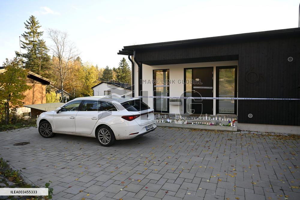 Police tape and candles at Janne Puhakka's residence