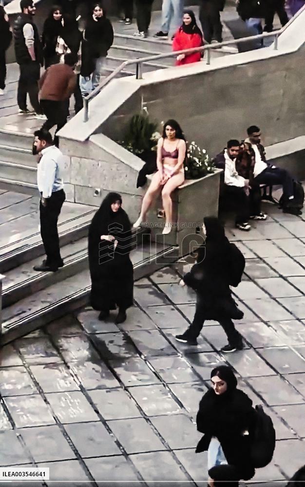 Iranian Woman Detained After Taking Clothes Off At University - Tehran