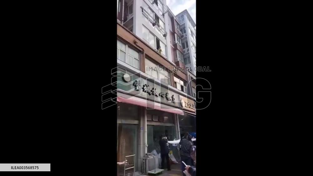 China: Toddler Rescued After Dangling From Window In Suqian, Jiangsu