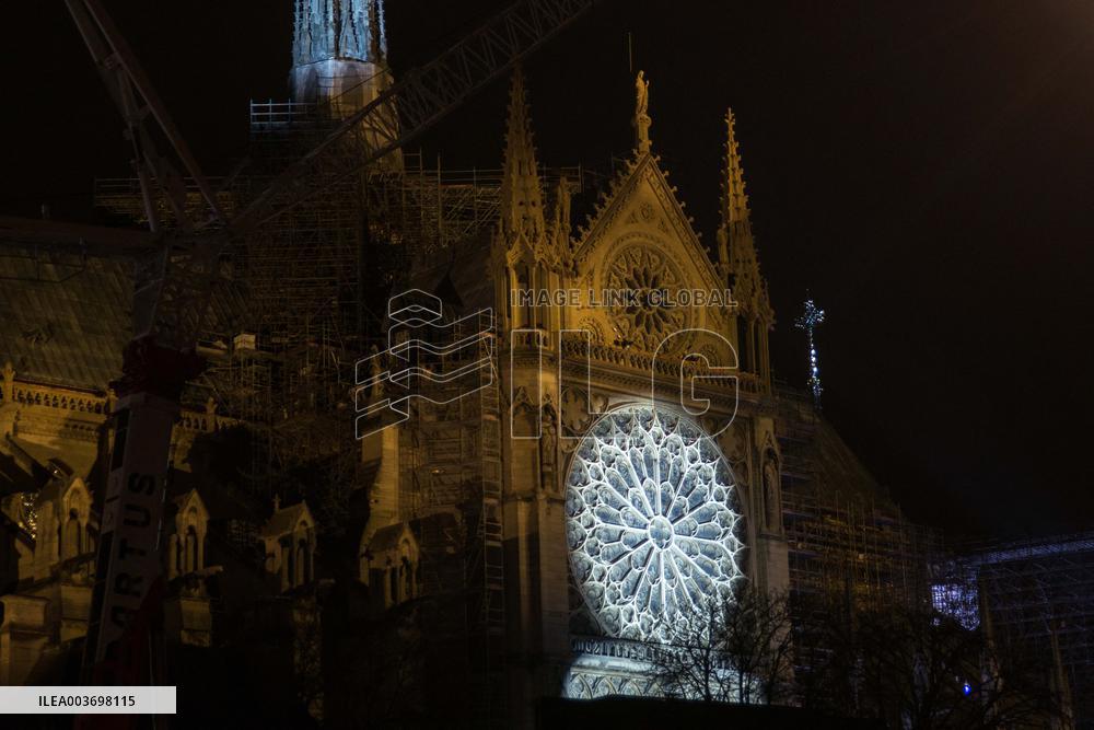 A Light Show Projected On The Facade Of Notre-Dame Cathedral - Paris
