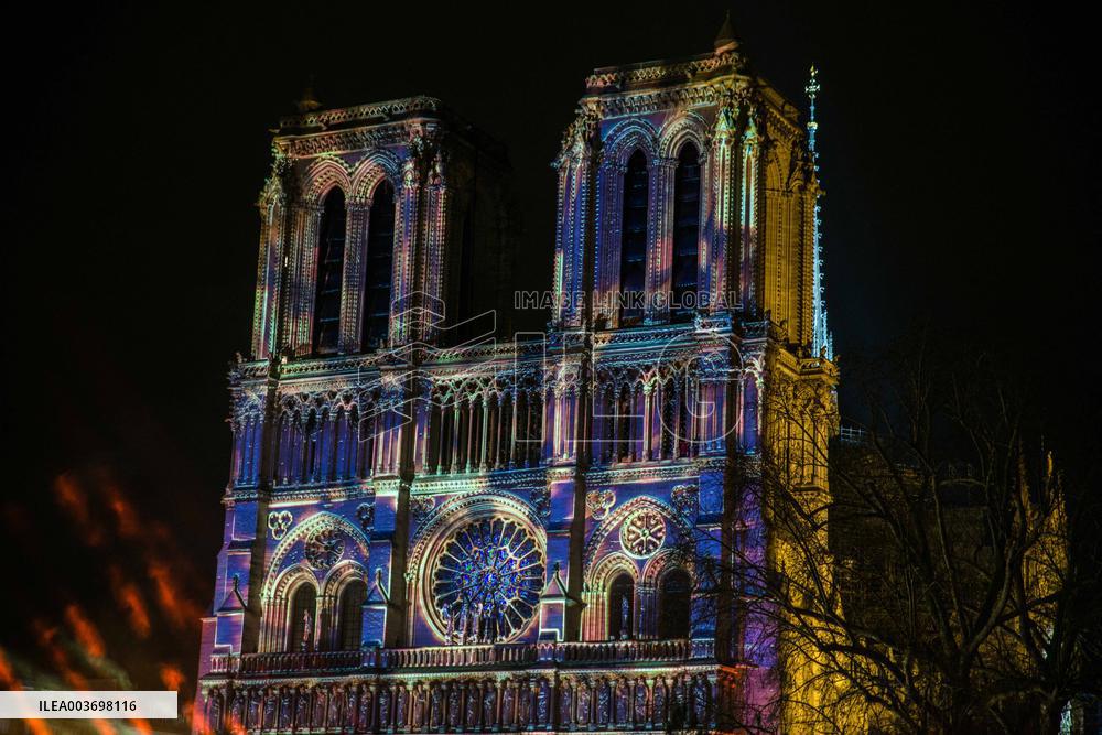 A Light Show Projected On The Facade Of Notre-Dame Cathedral - Paris
