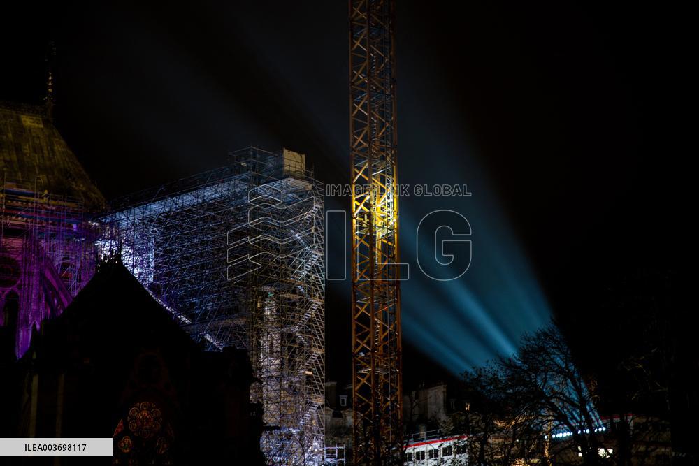 A Light Show Projected On The Facade Of Notre-Dame Cathedral - Paris