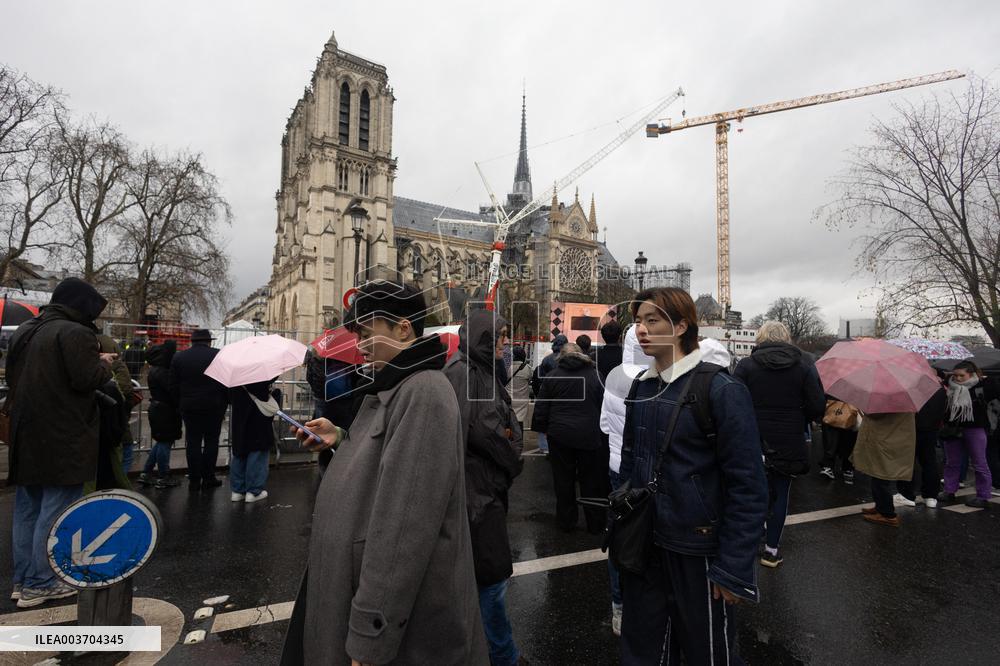 People attend the first mass outside Notre Dame Cathedral - Paris