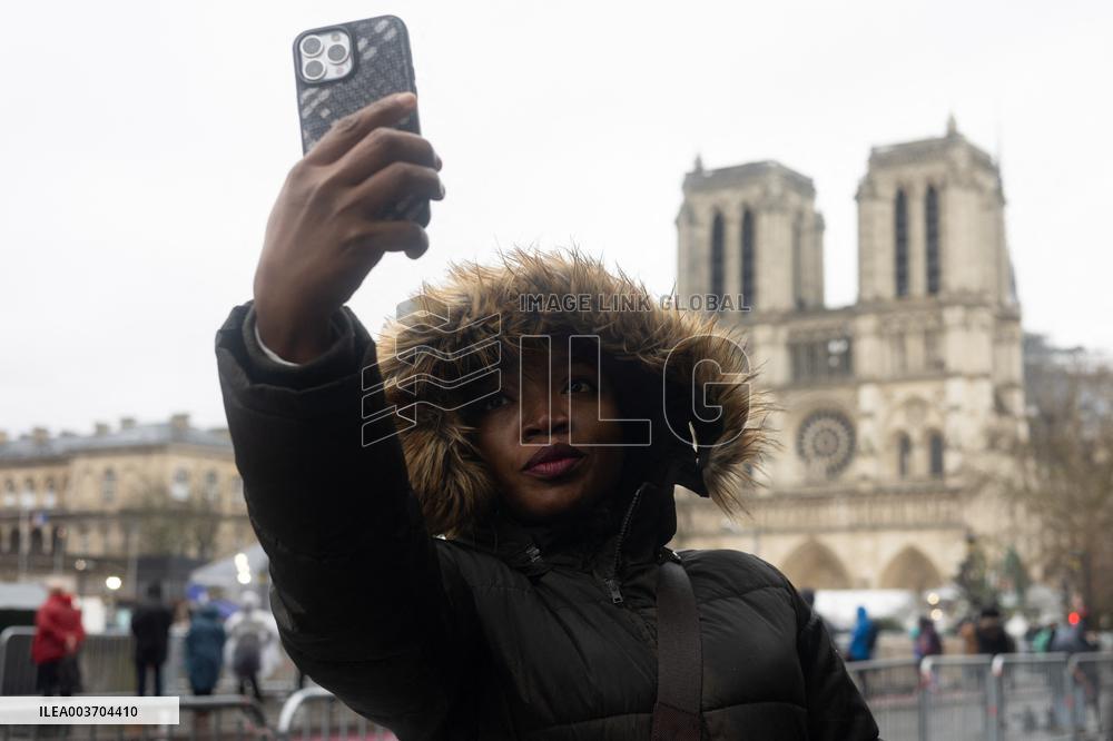 People attend the first mass outside Notre Dame Cathedral - Paris