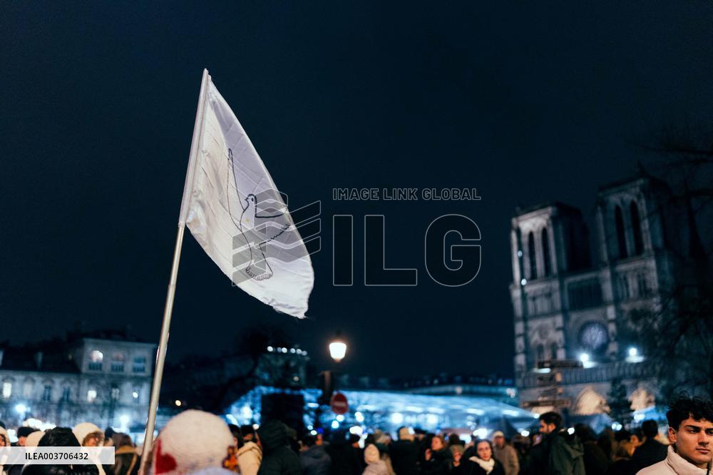 People attend the second mass outside Notre Dame Cathedral - Paris