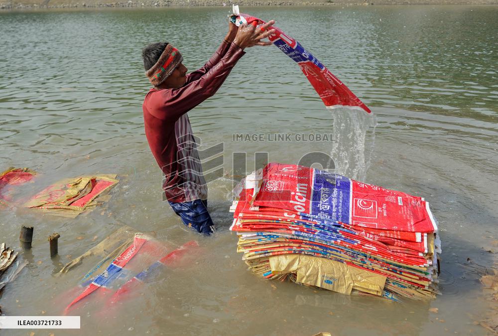Cement Bags Washed In The Heavy Polluted Surma River - Bangladesh