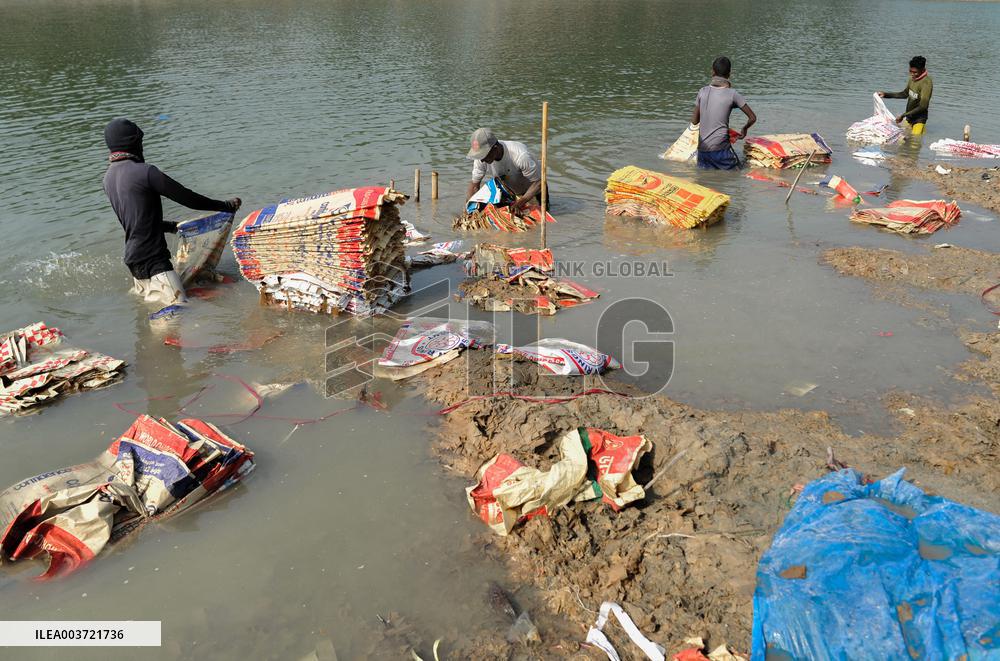 Cement Bags Washed In The Heavy Polluted Surma River - Bangladesh
