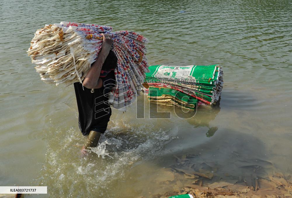 Cement Bags Washed In The Heavy Polluted Surma River - Bangladesh