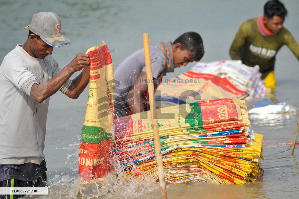 Cement Bags Washed In The Heavy Polluted Surma River - Bangladesh