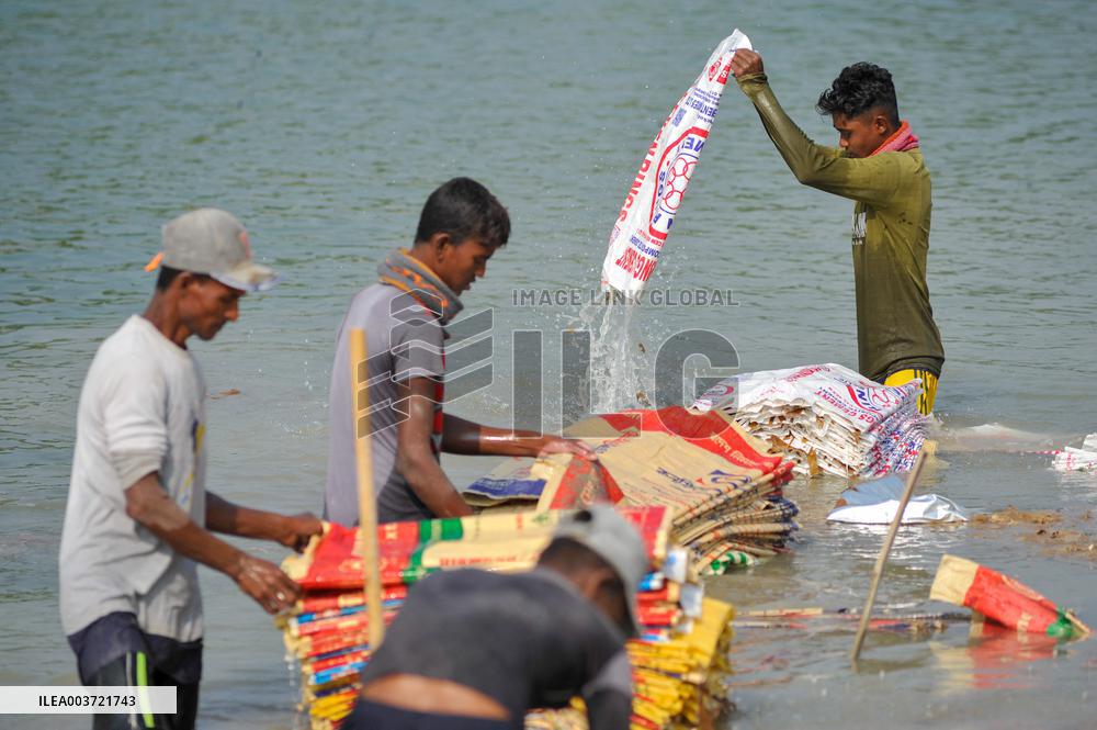 Cement Bags Washed In The Heavy Polluted Surma River - Bangladesh
