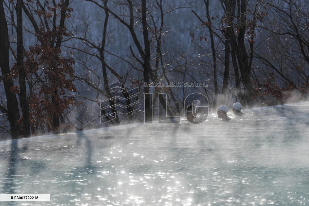 Tourists Enjoy An Outdoor Hot Spring - China