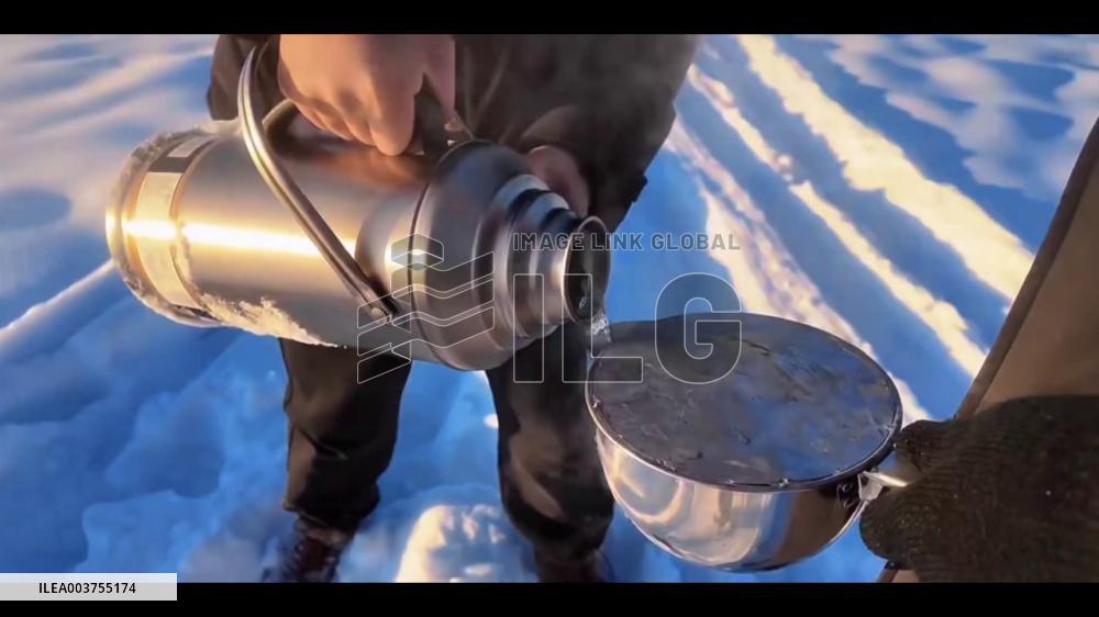 China: Stunning Golden Ice Hue Created By Combination Of Boiling Water And Freezing Temperatures