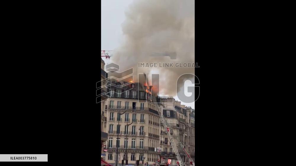 France: Christmas Eve Fire Engulfs Top Floor Of Building Near Paris Saint-Lazare Station